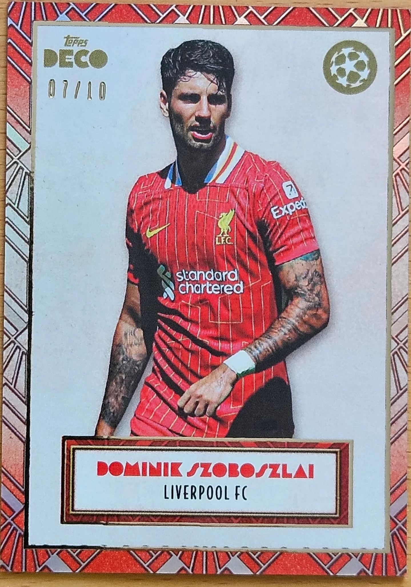 front of Dominik Szoboszlai's Topps Deco UEFA Champions League card at high resolution