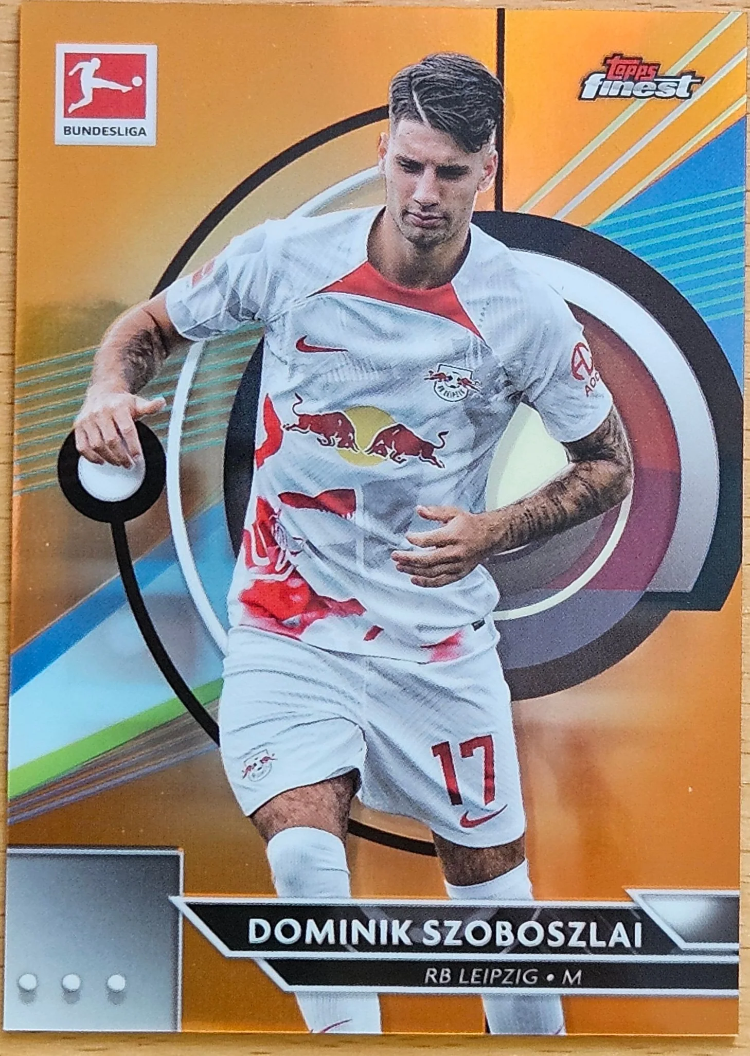 front of Dominik Szoboszlai's Topps Finest Bundesliga card at high resolution