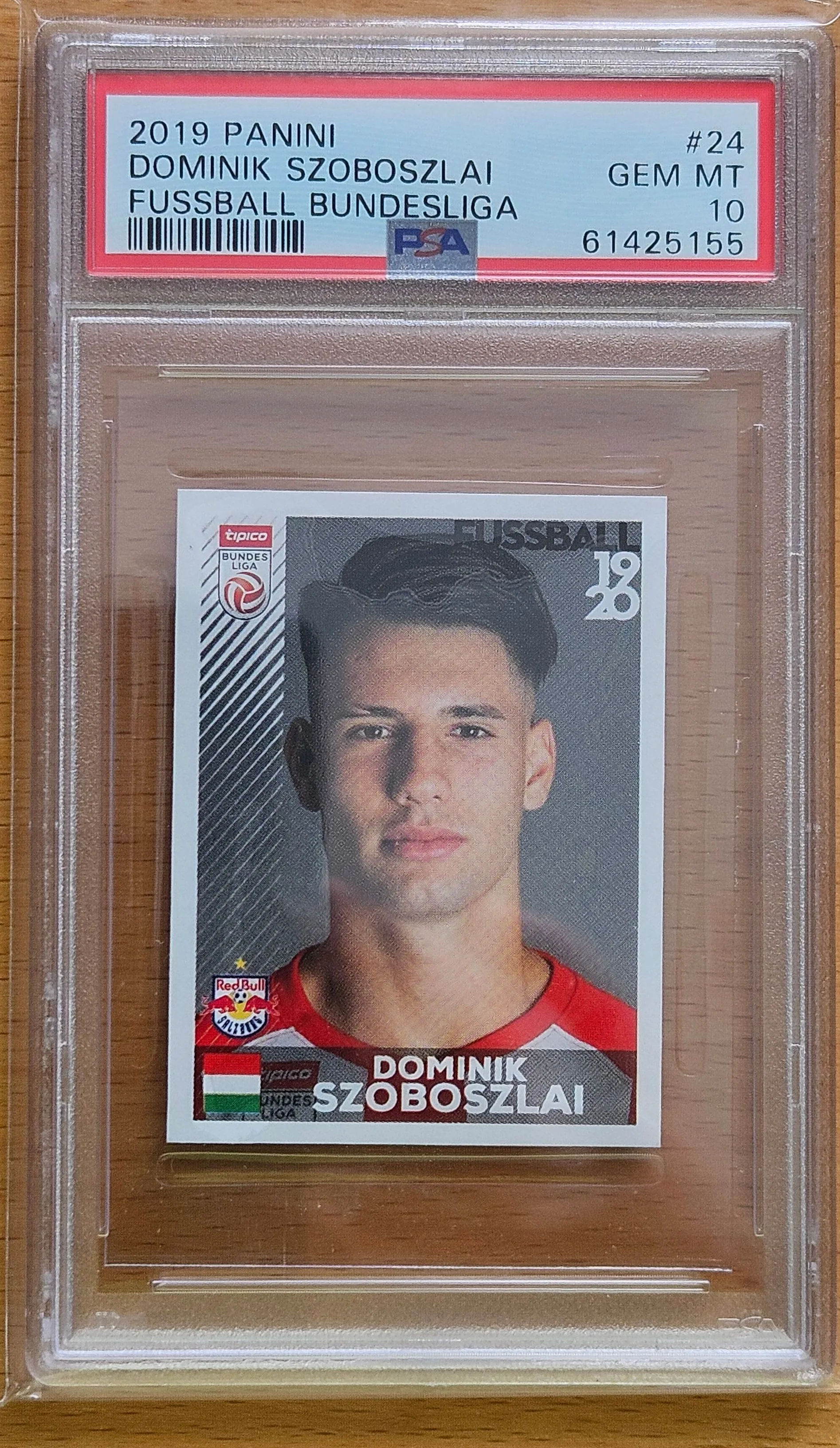 front of Dominik Szoboszlai's Panini Fussball Bundesliga Stickers card at high resolution