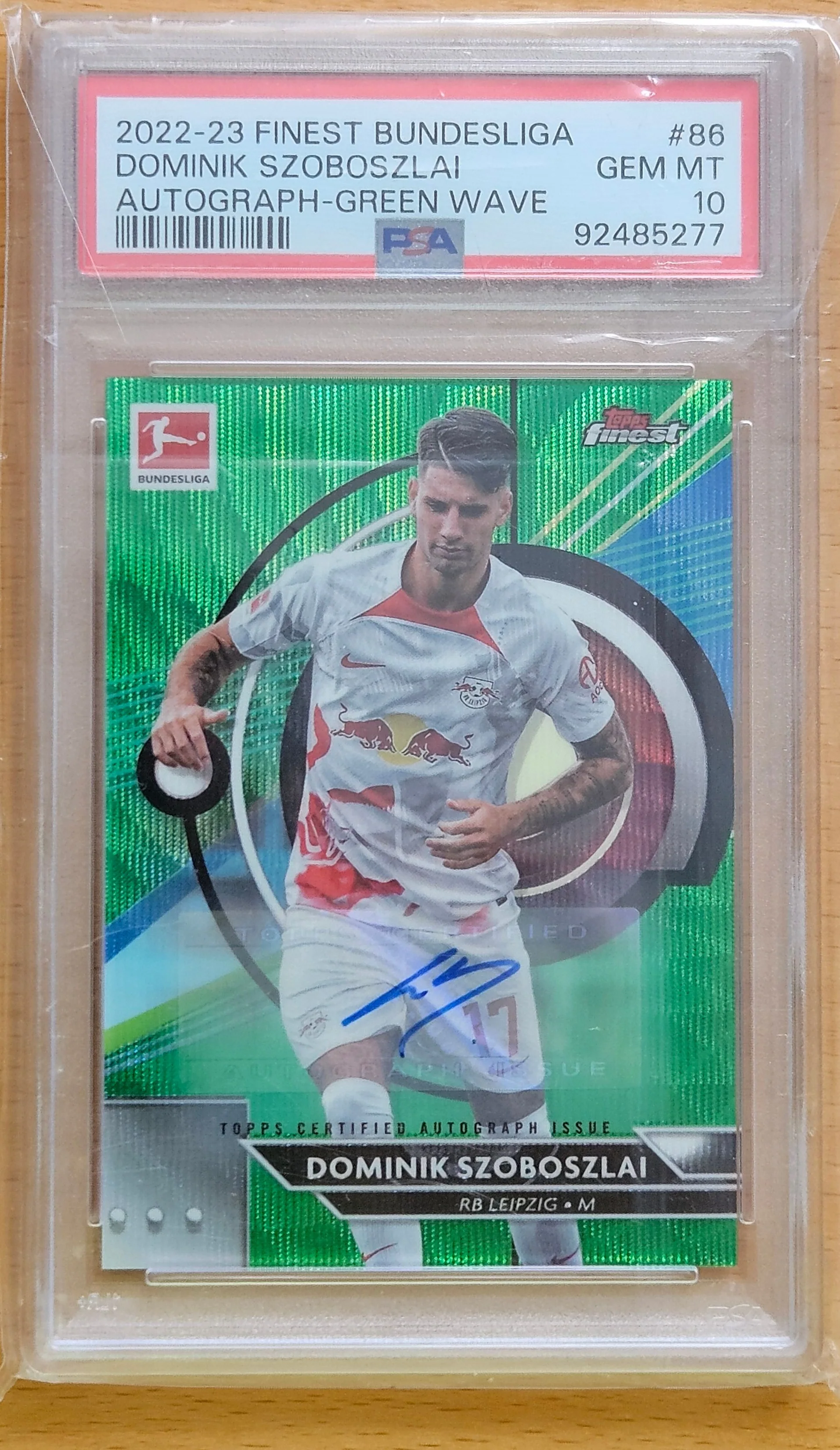 front of Dominik Szoboszlai's Topps Finest Bundesliga card at high resolution