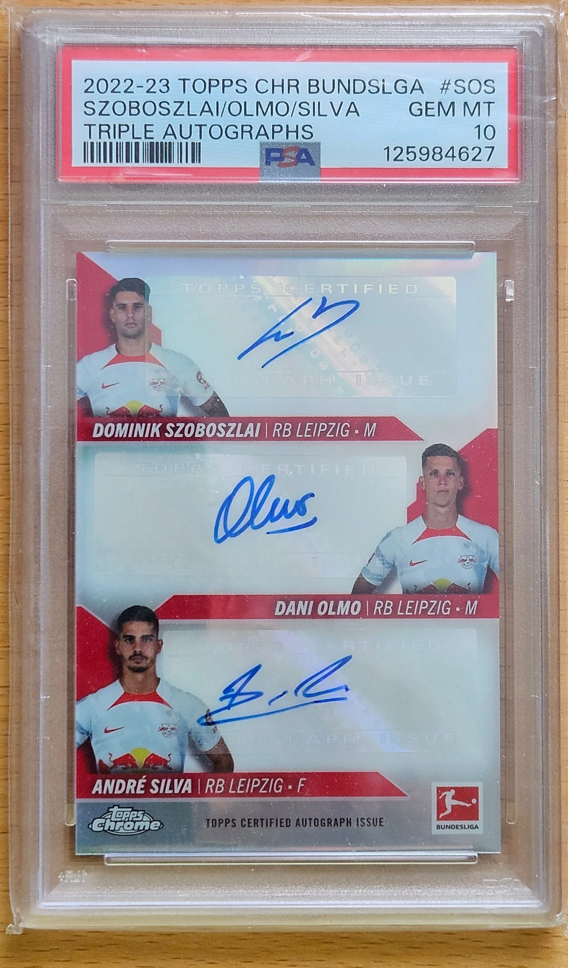 front of Dominik Szoboszlai's Topps Chrome Bundesliga card at high resolution